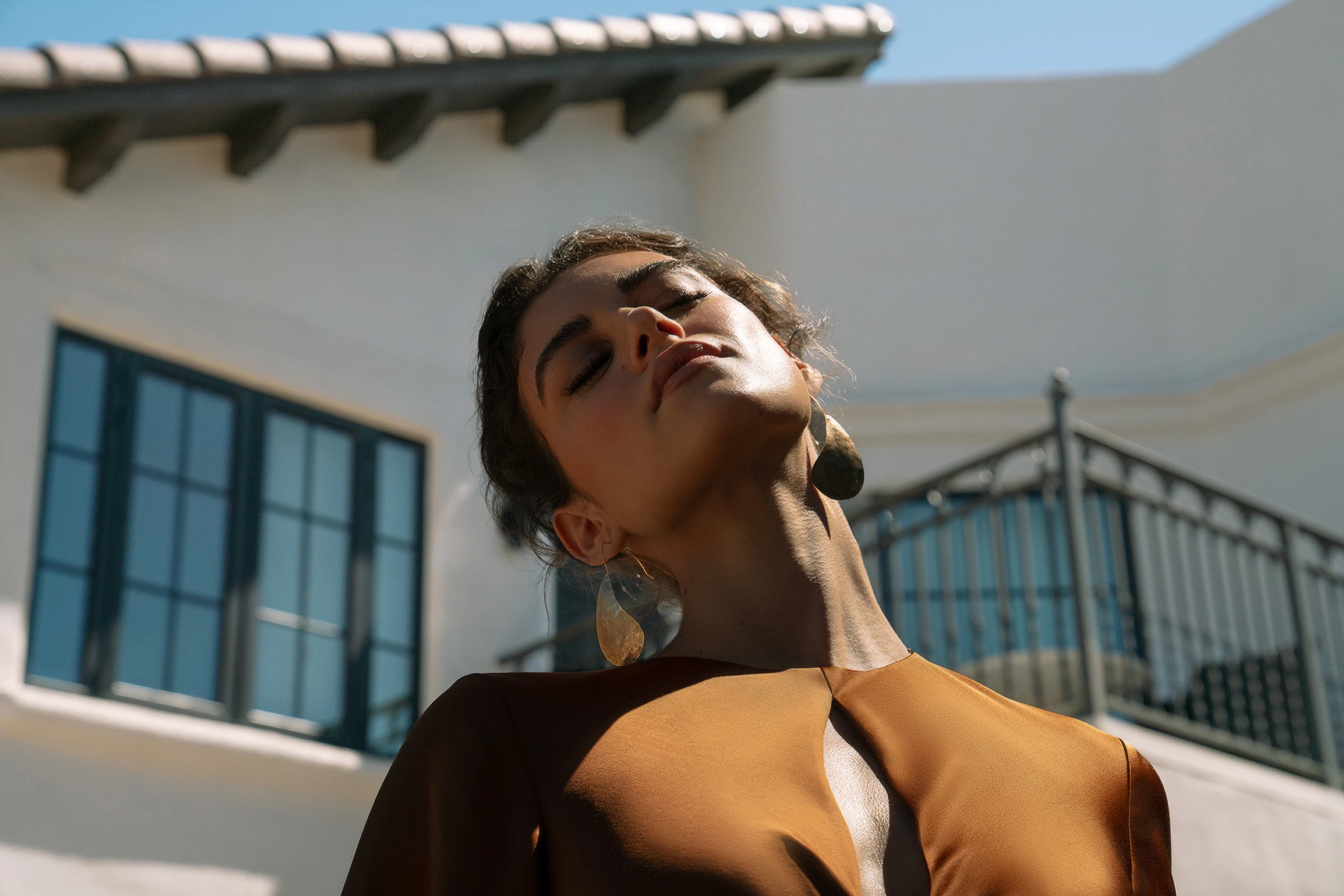a woman with her eyes closed