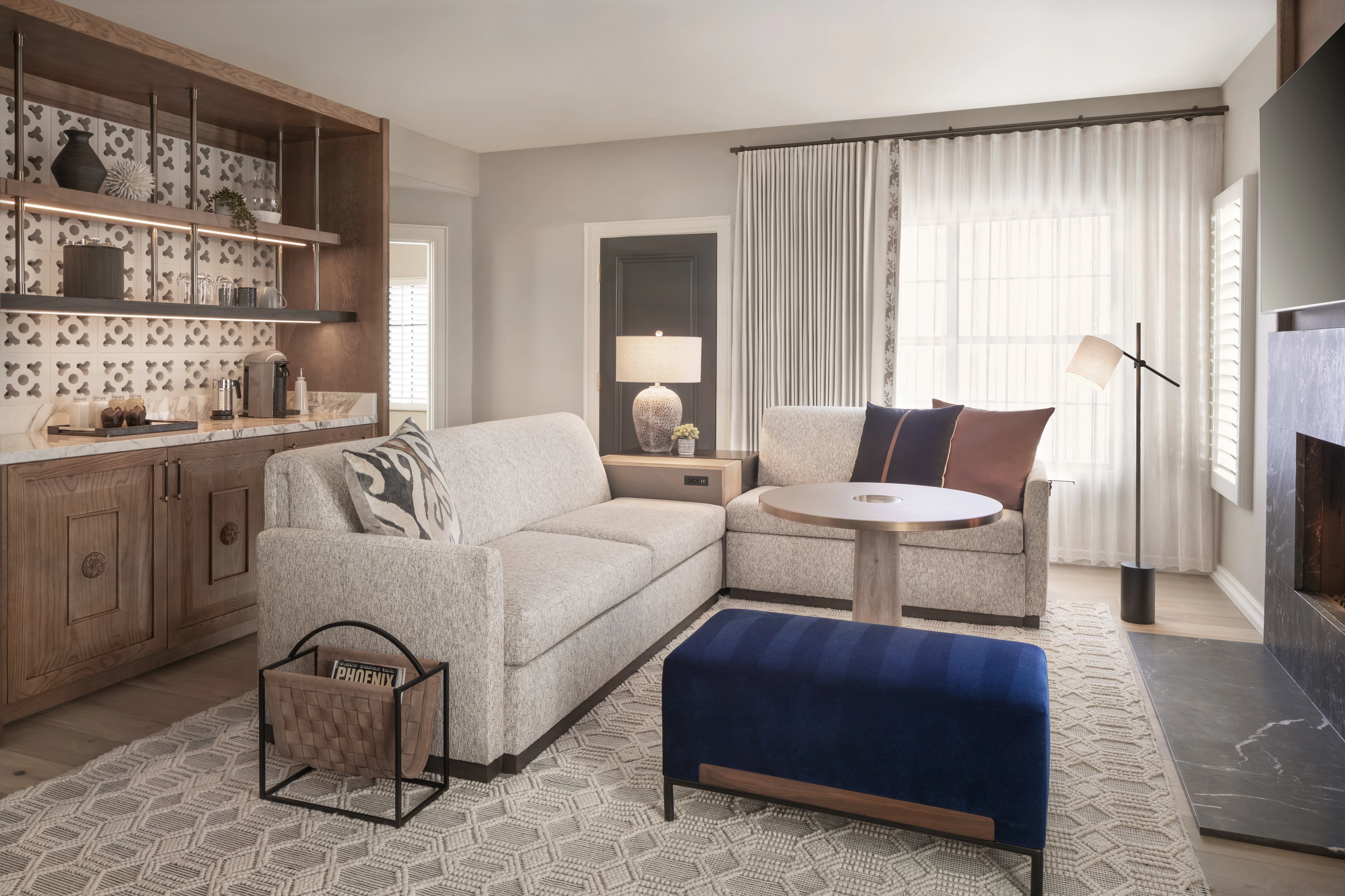 living room with 2 couches, table, and an ottoman