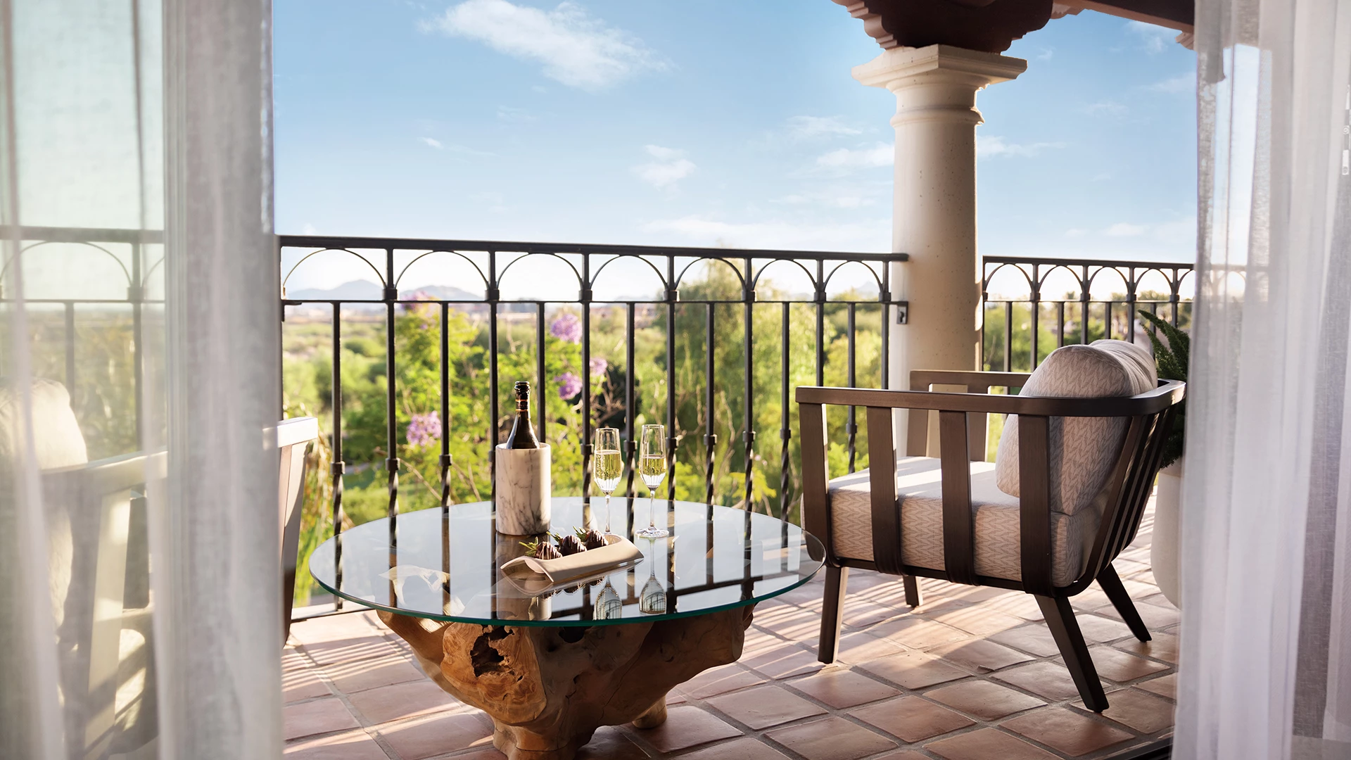 a patio with a table and chairs