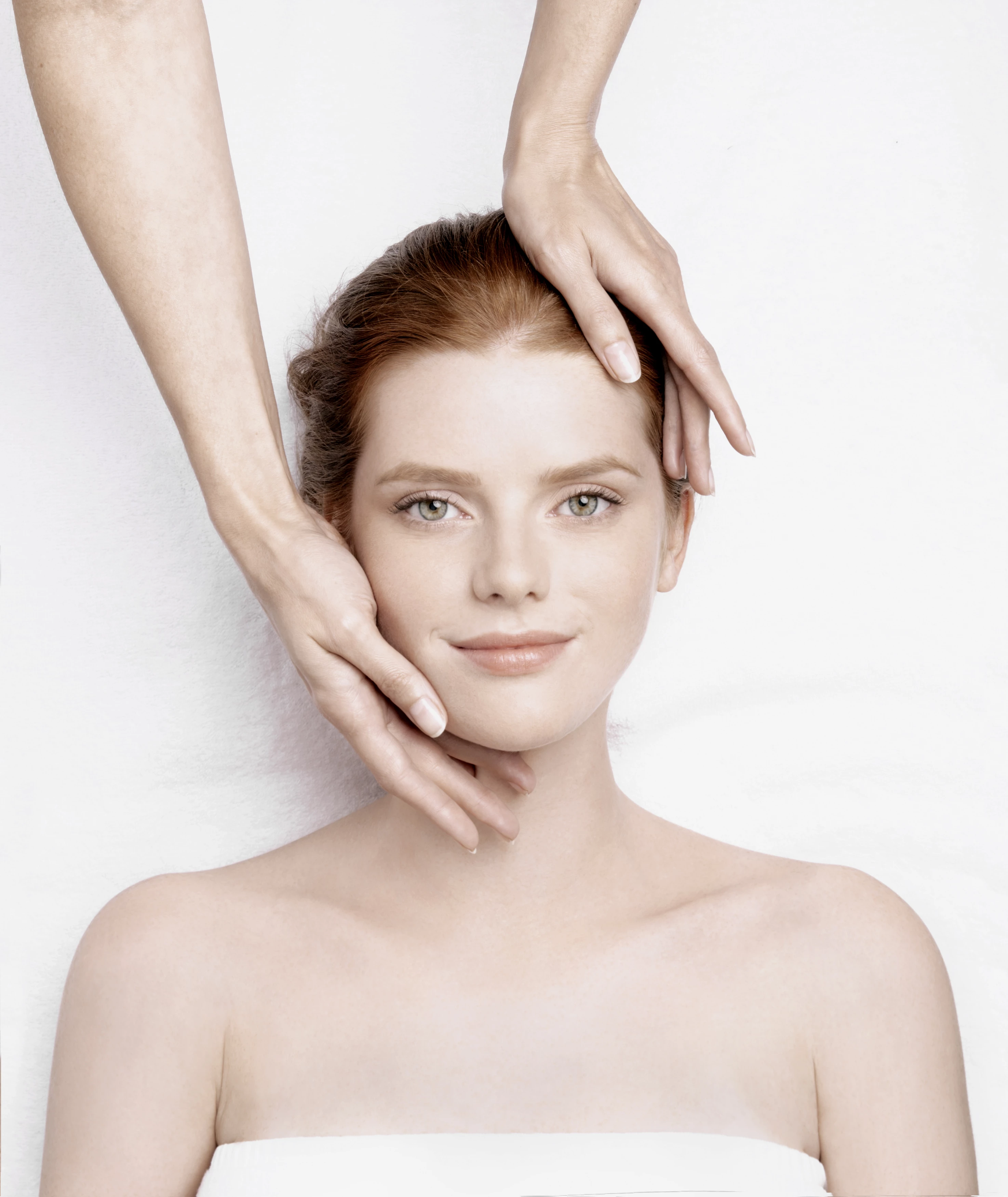 a girl laying down getting a facial