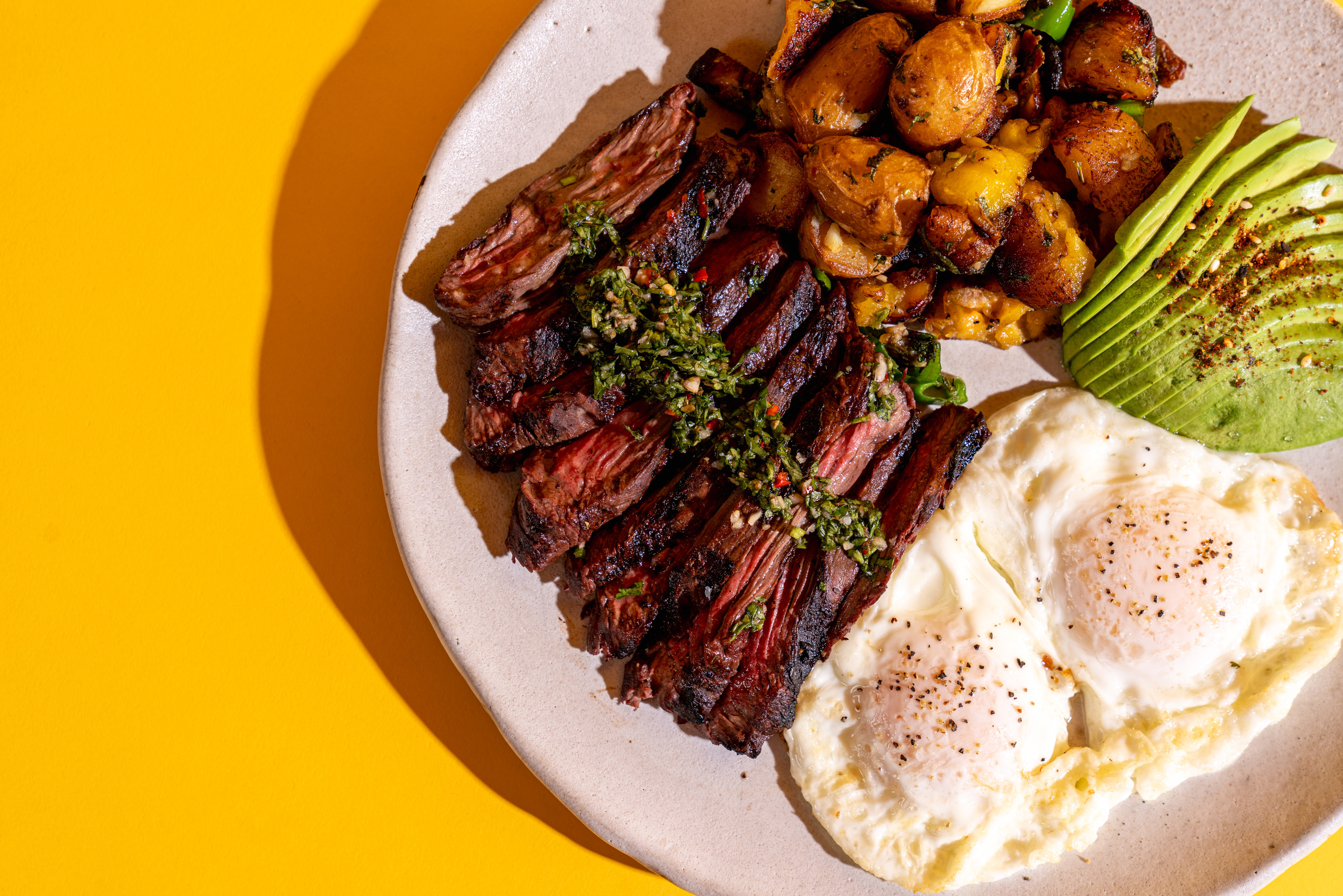 a plate of steak and eggs