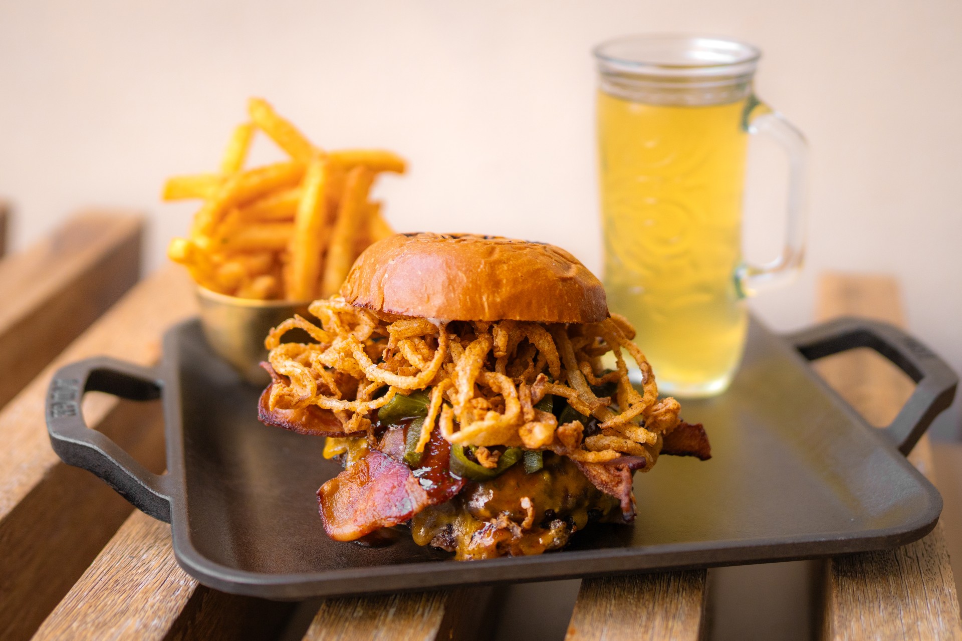 a burger and fries on a tray