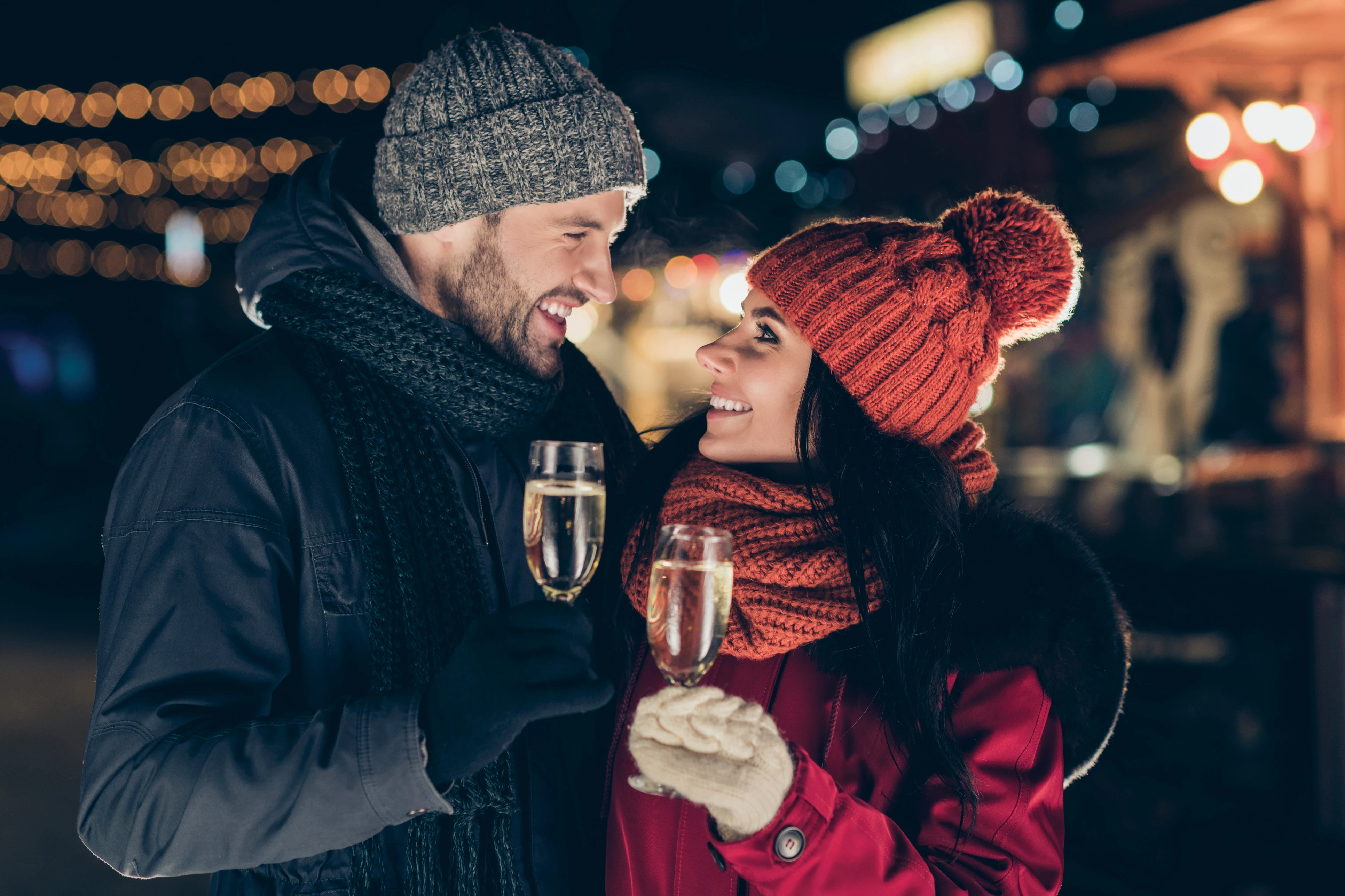 couple enjoying champagne in the winter