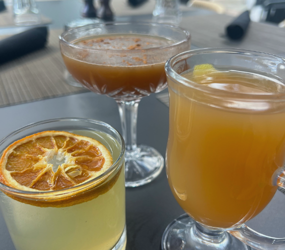 a group of glasses with liquid in them