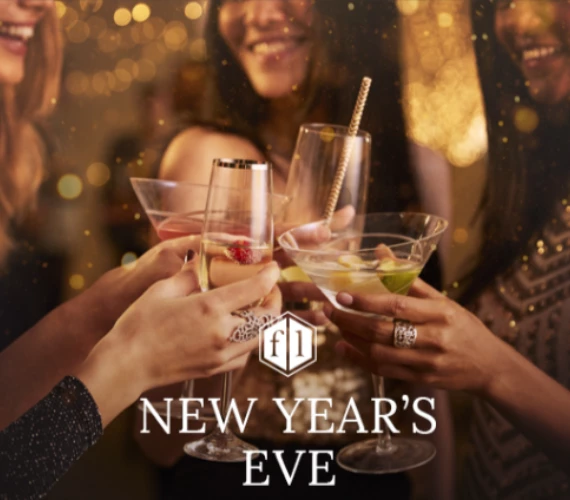 a group of women holding drinks