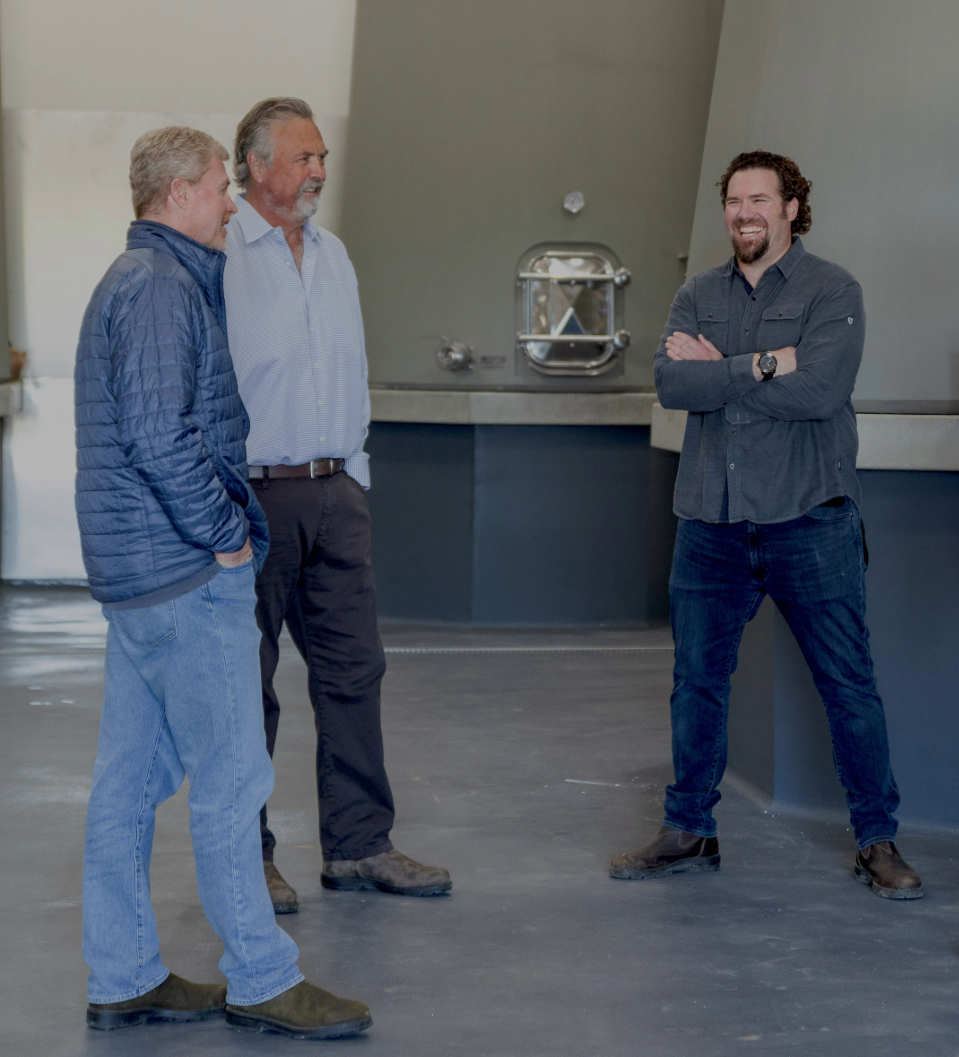 a group of men standing in a room