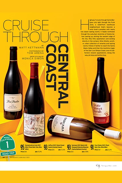 a magazine cover with bottles of wine