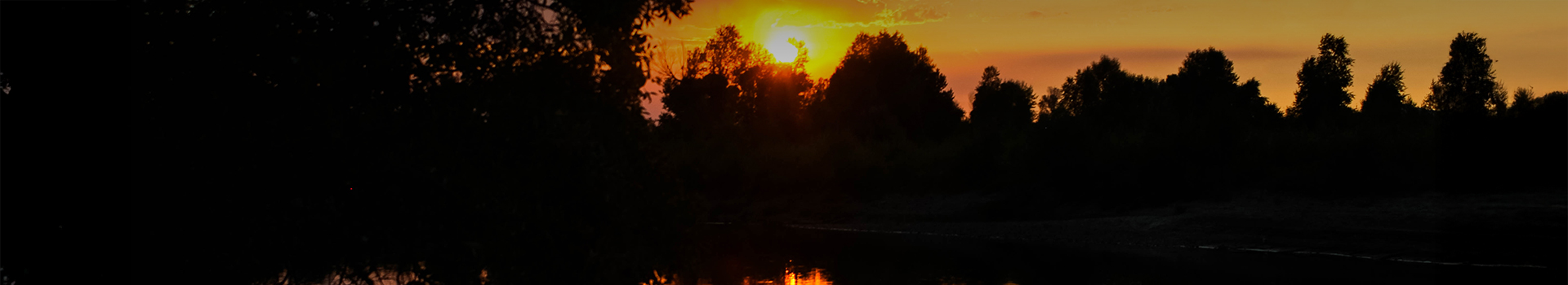 a sunset over a river
