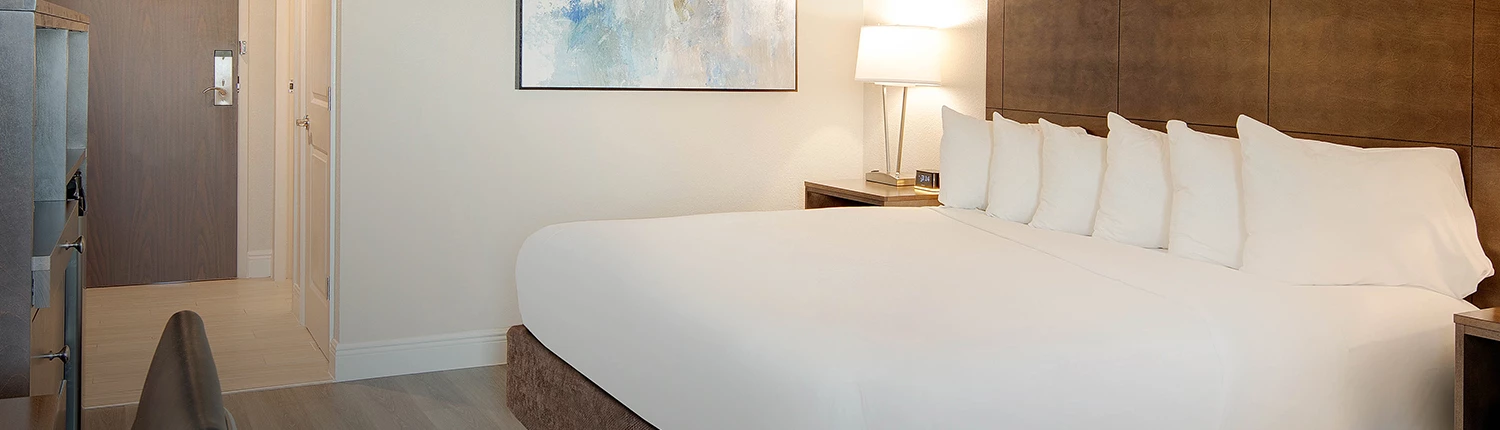 king sized bed with multiple pillows on top