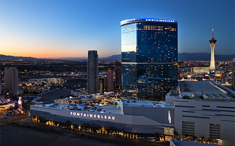 a city skyline with a tall building