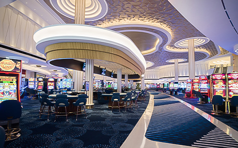 a casino with tables and slot machines