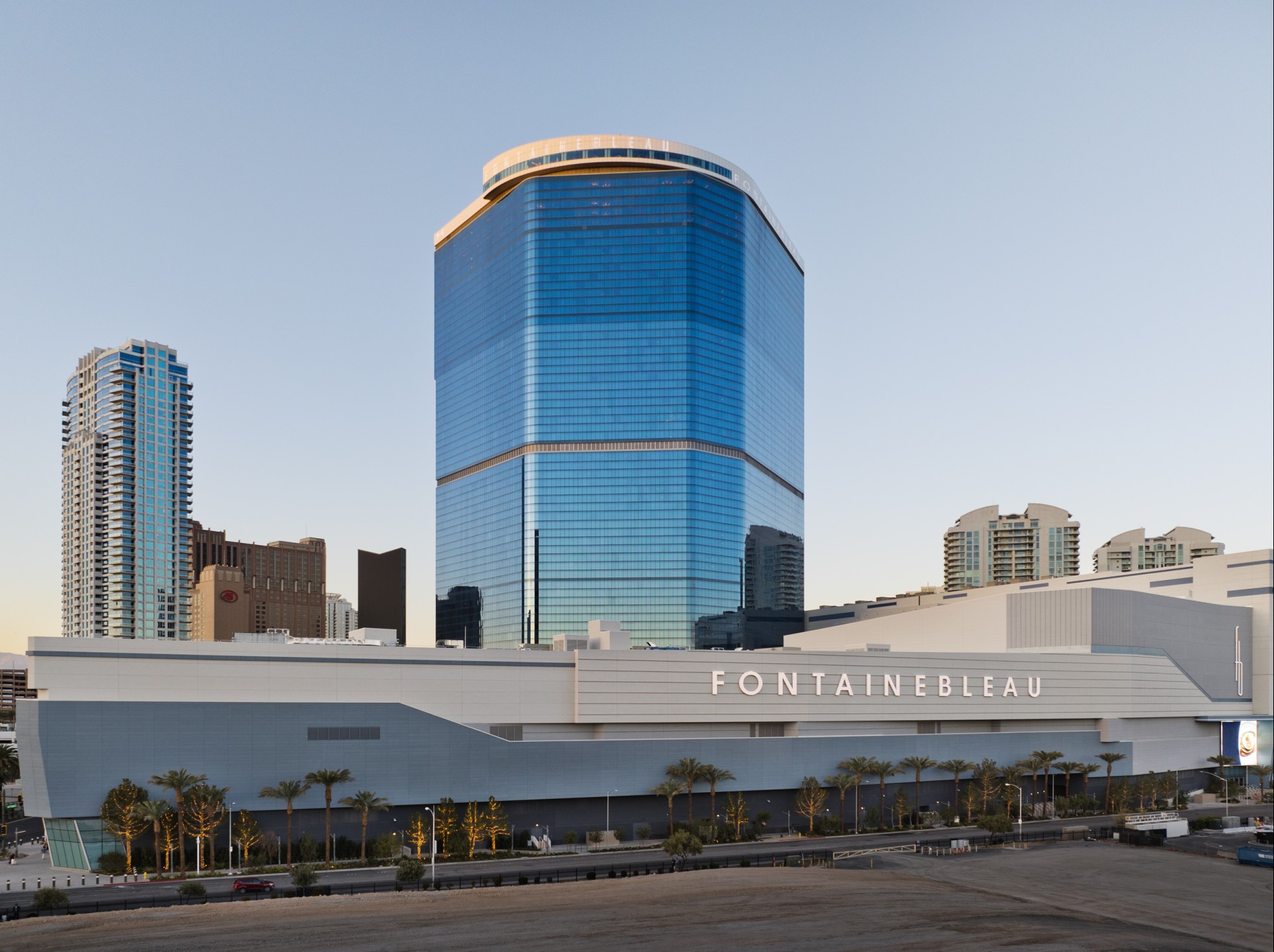 a large building with a blue glass tower