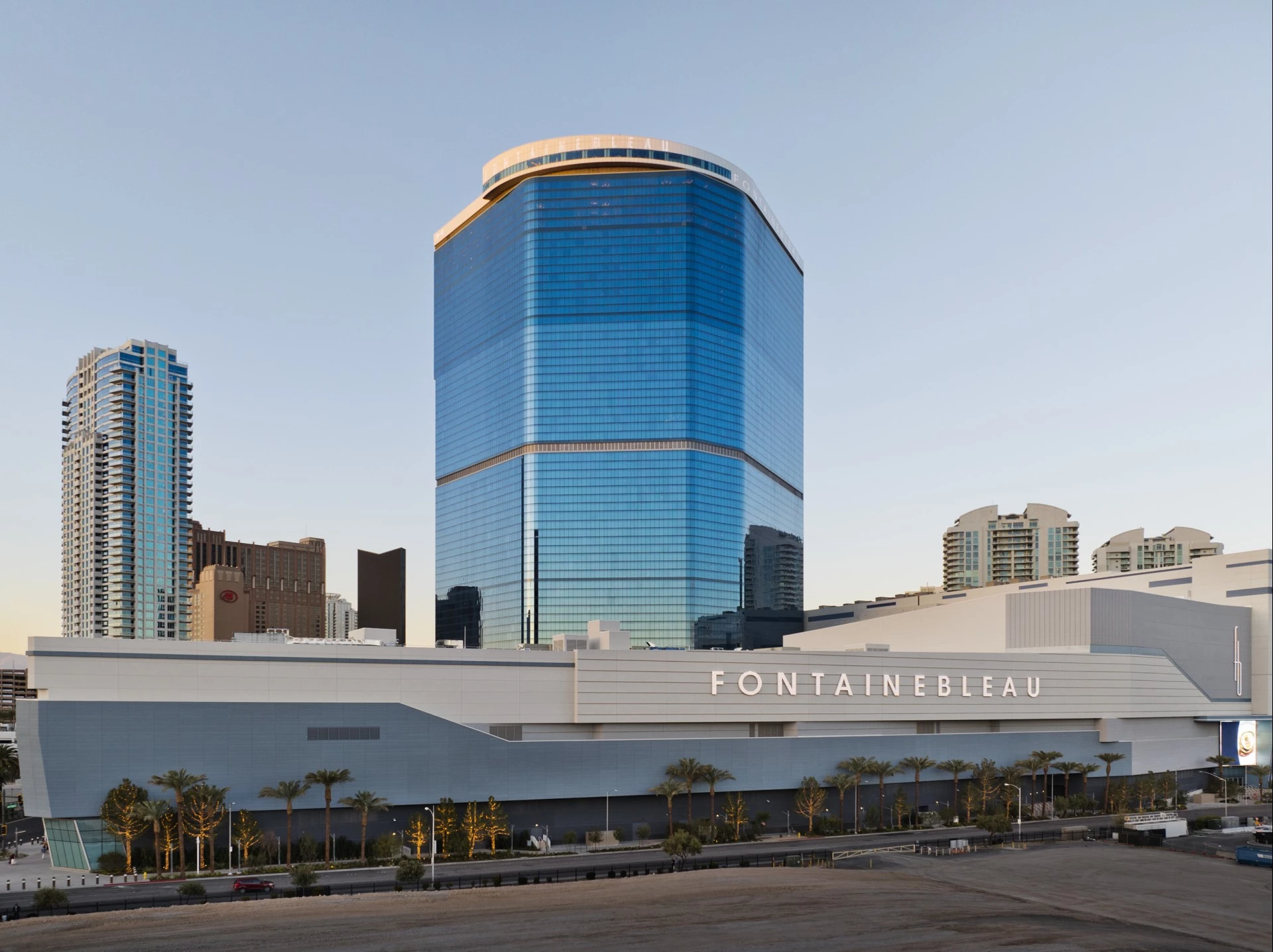 a large building with a blue glass tower