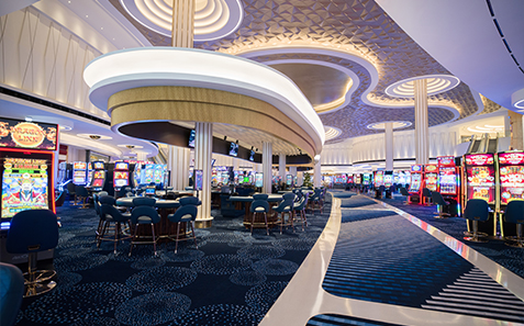 a casino with tables and chairs