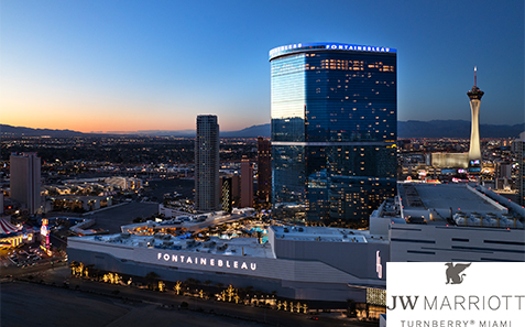 a city skyline with a tall building