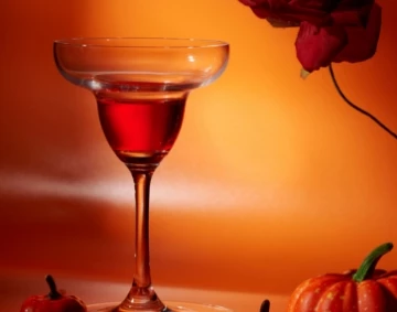 a glass with a drink in it