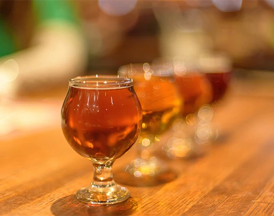 a row of glasses of liquid