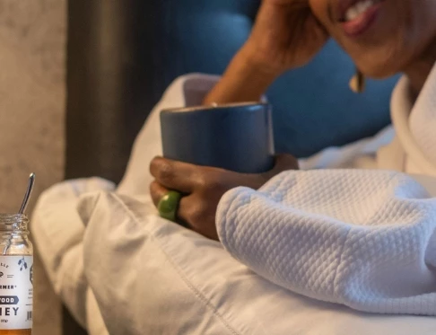 a person holding a cup