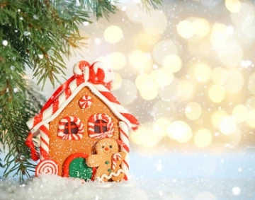 a gingerbread house with a gingerbread man and a gingerbread man on the snow