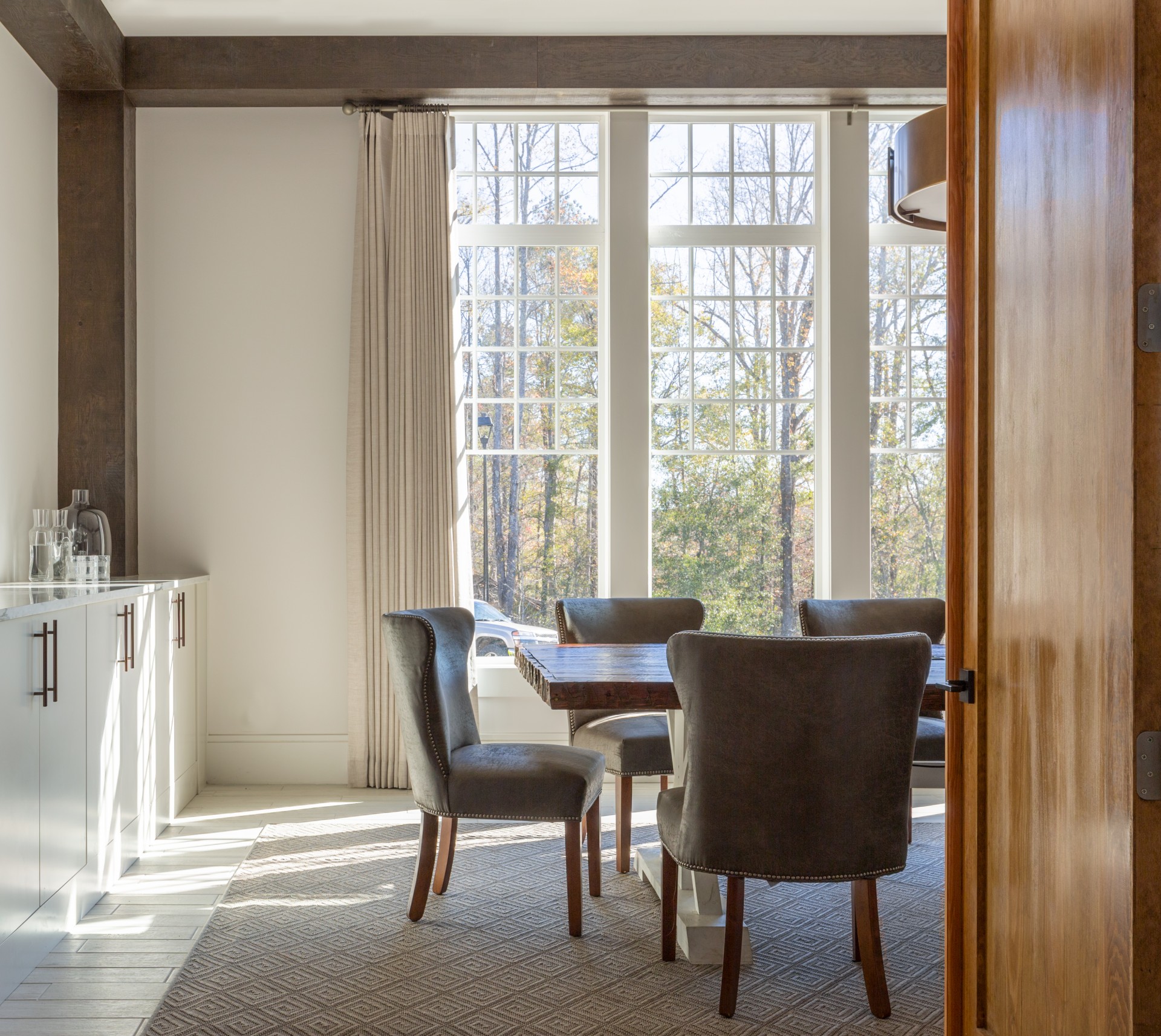 a dining room with a table and chairs