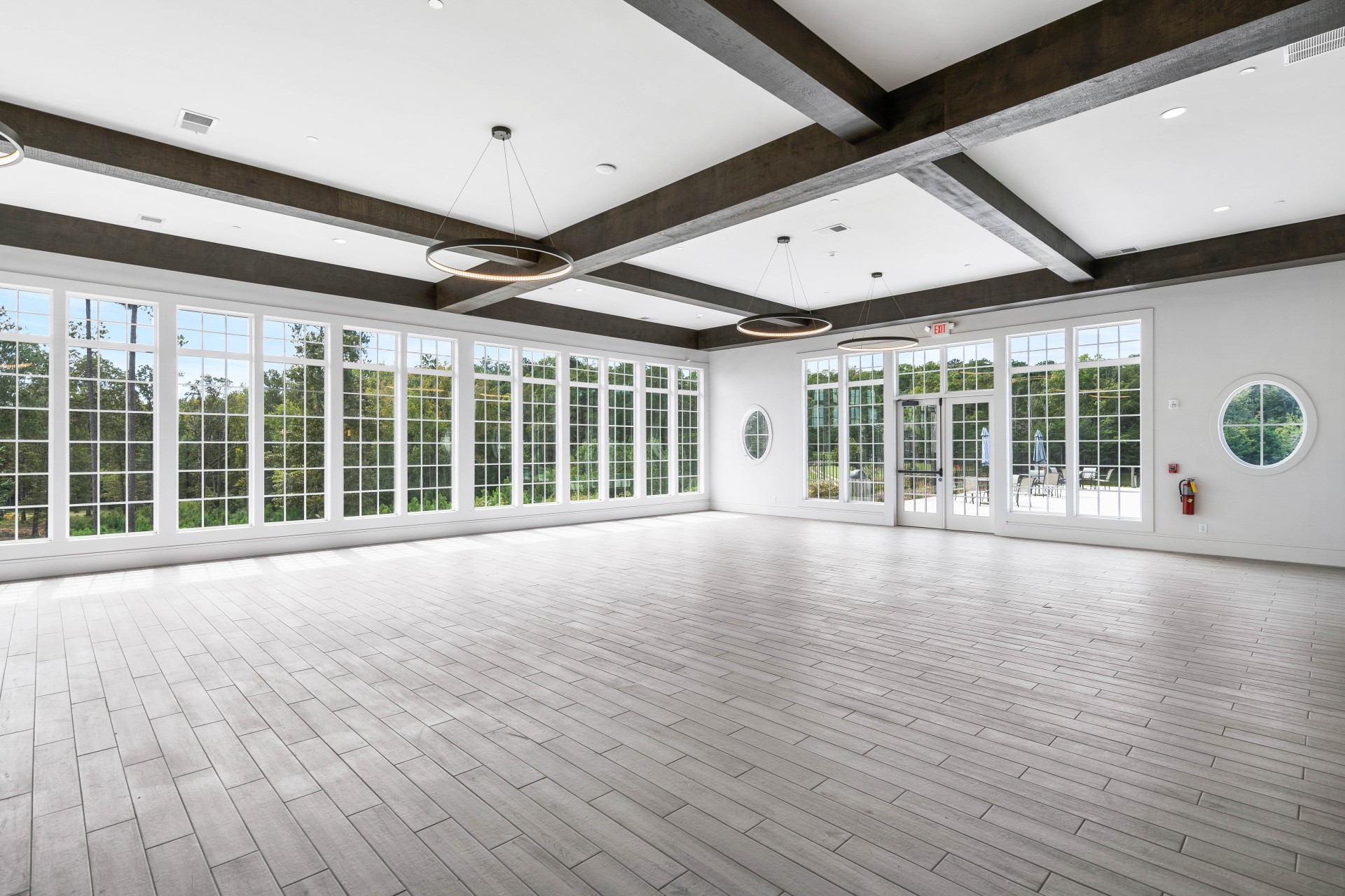 a large room with white walls and windows