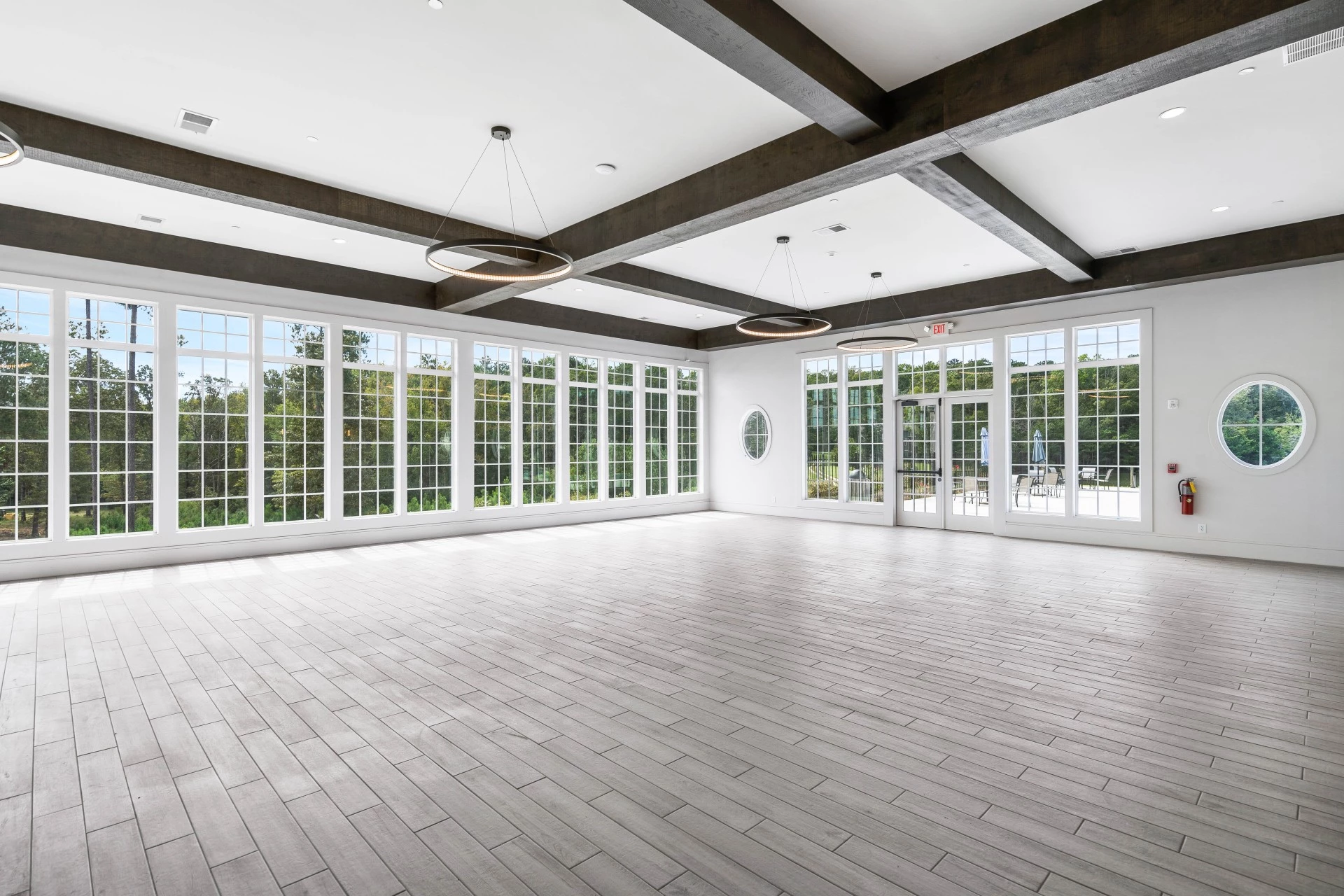 a large room with white walls and windows