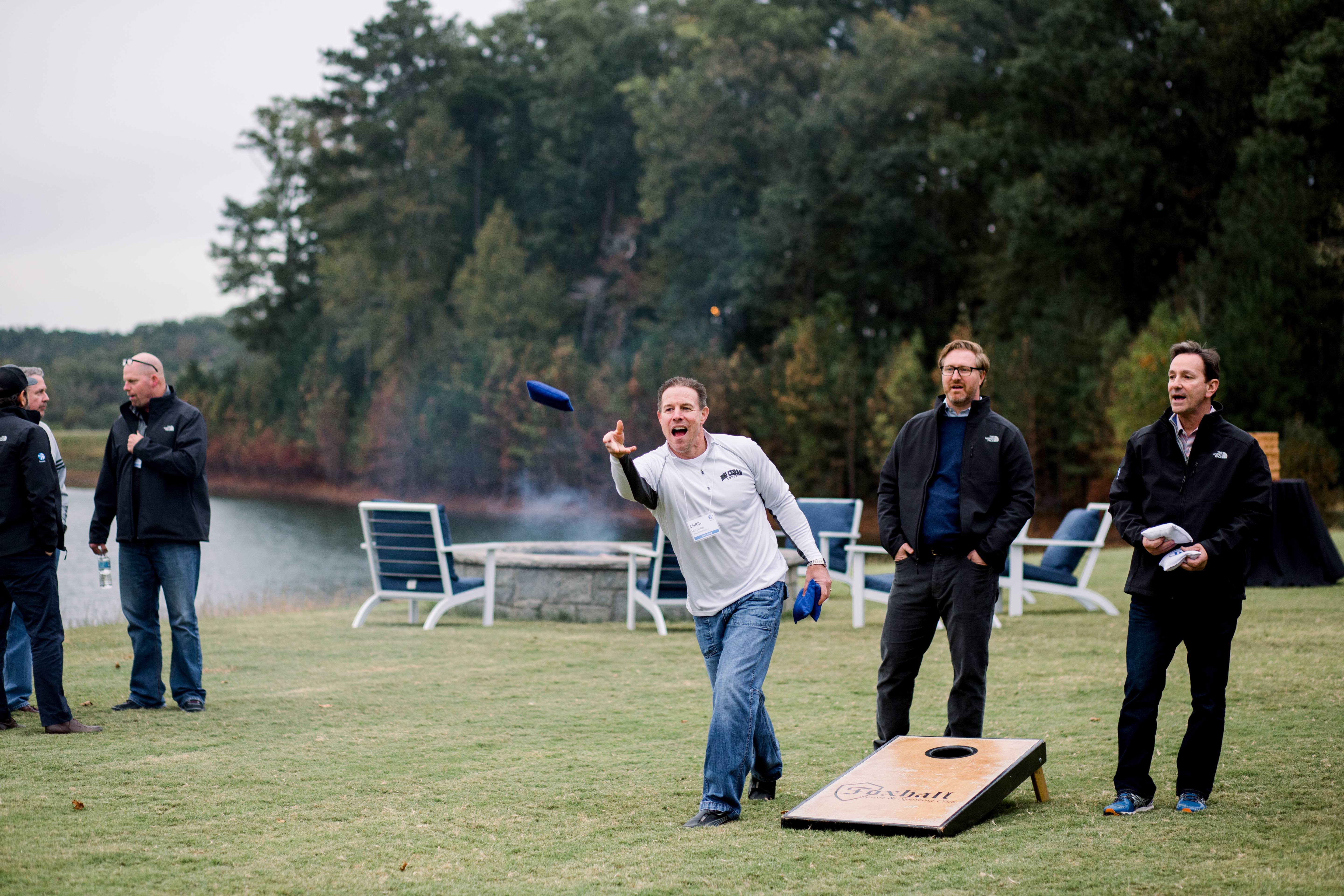 a group of men playing with a blue object