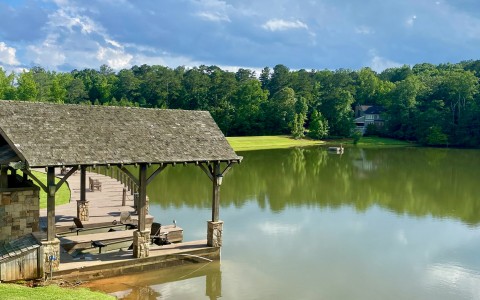 a dock with a boat on the water