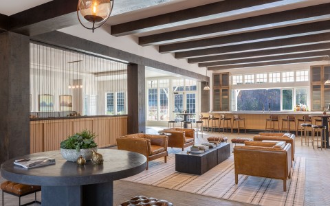 a room with a large table and chairs