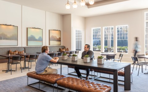 two men sitting at a table