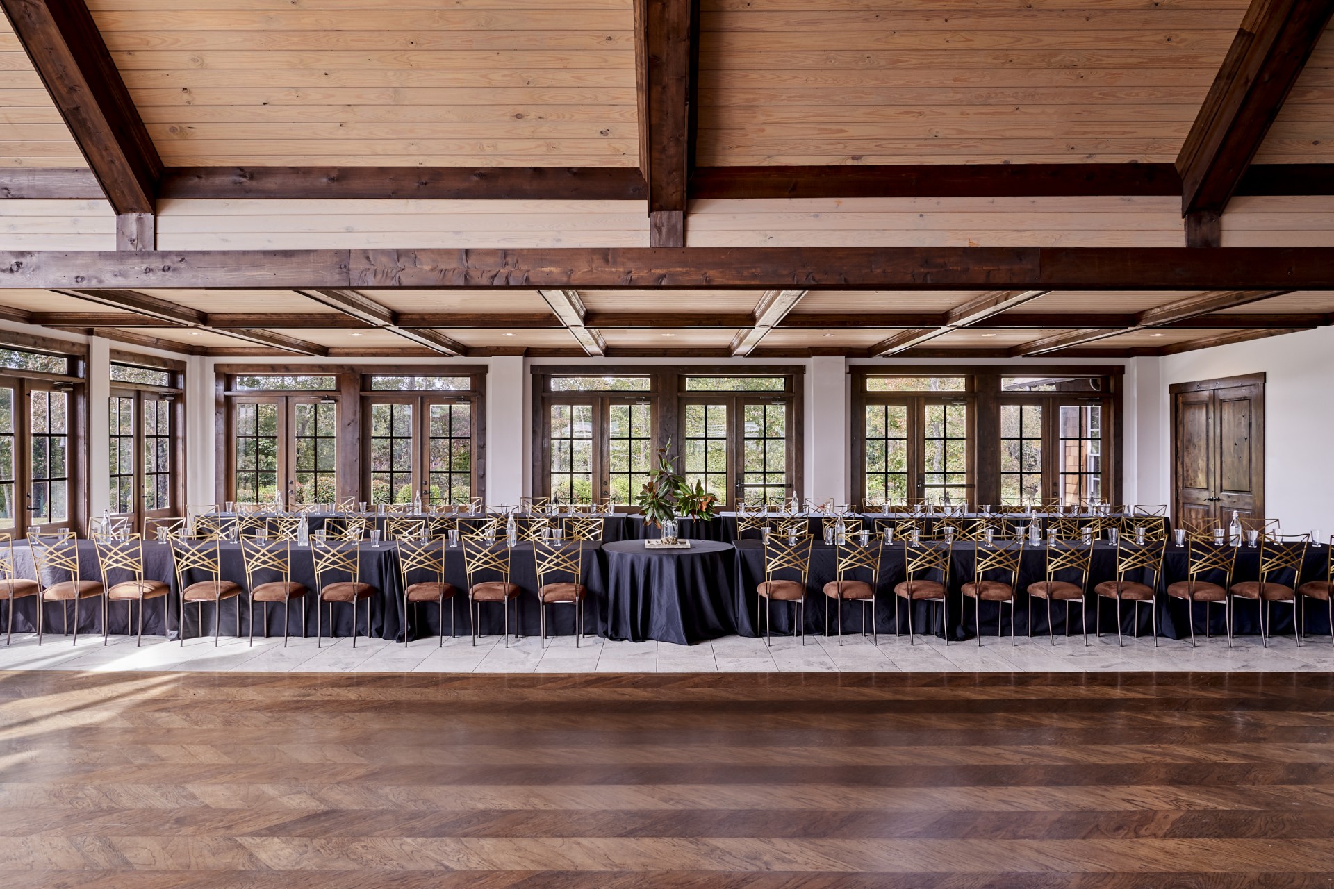 a long table with chairs and a table set up