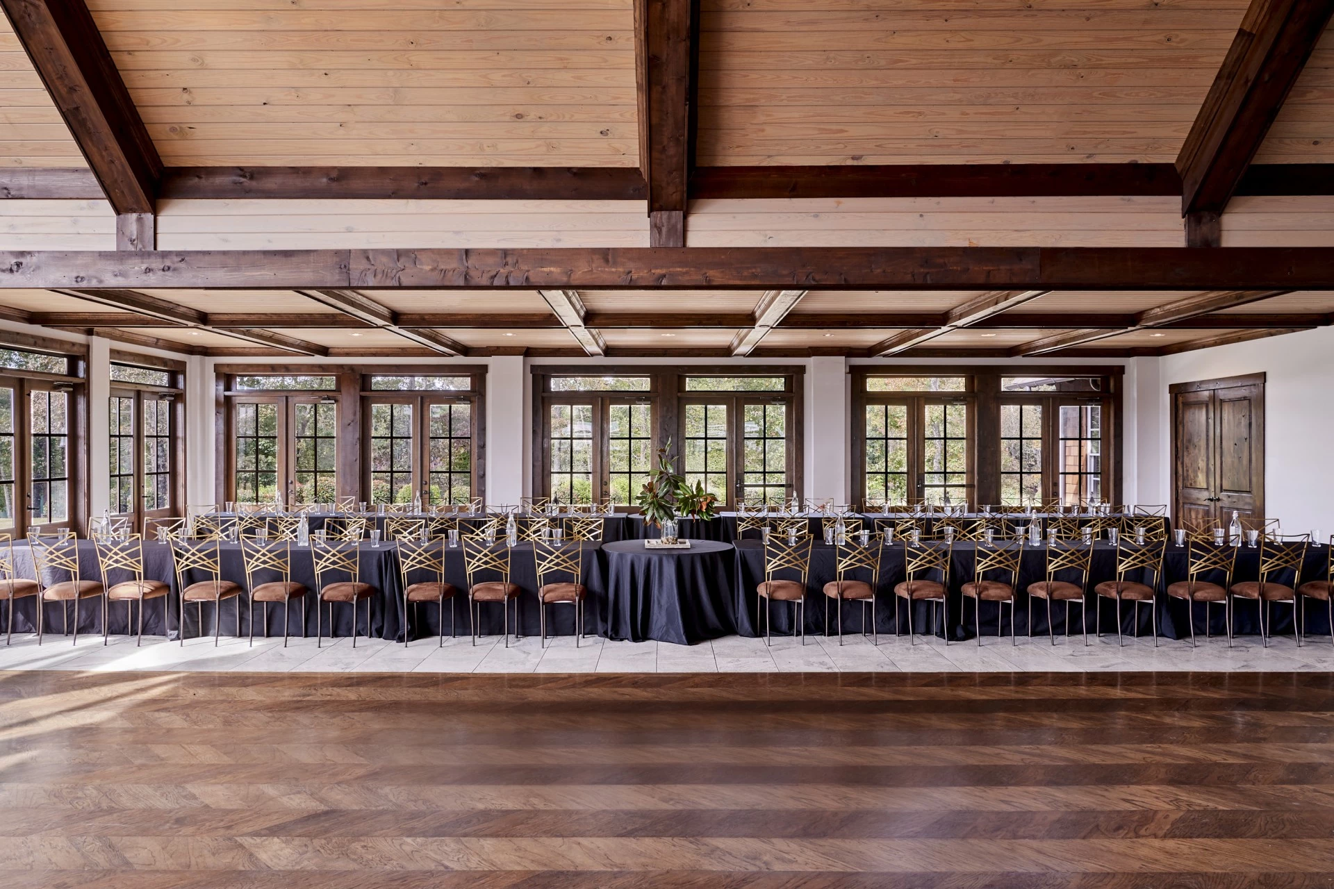 a long table with chairs and a table set up