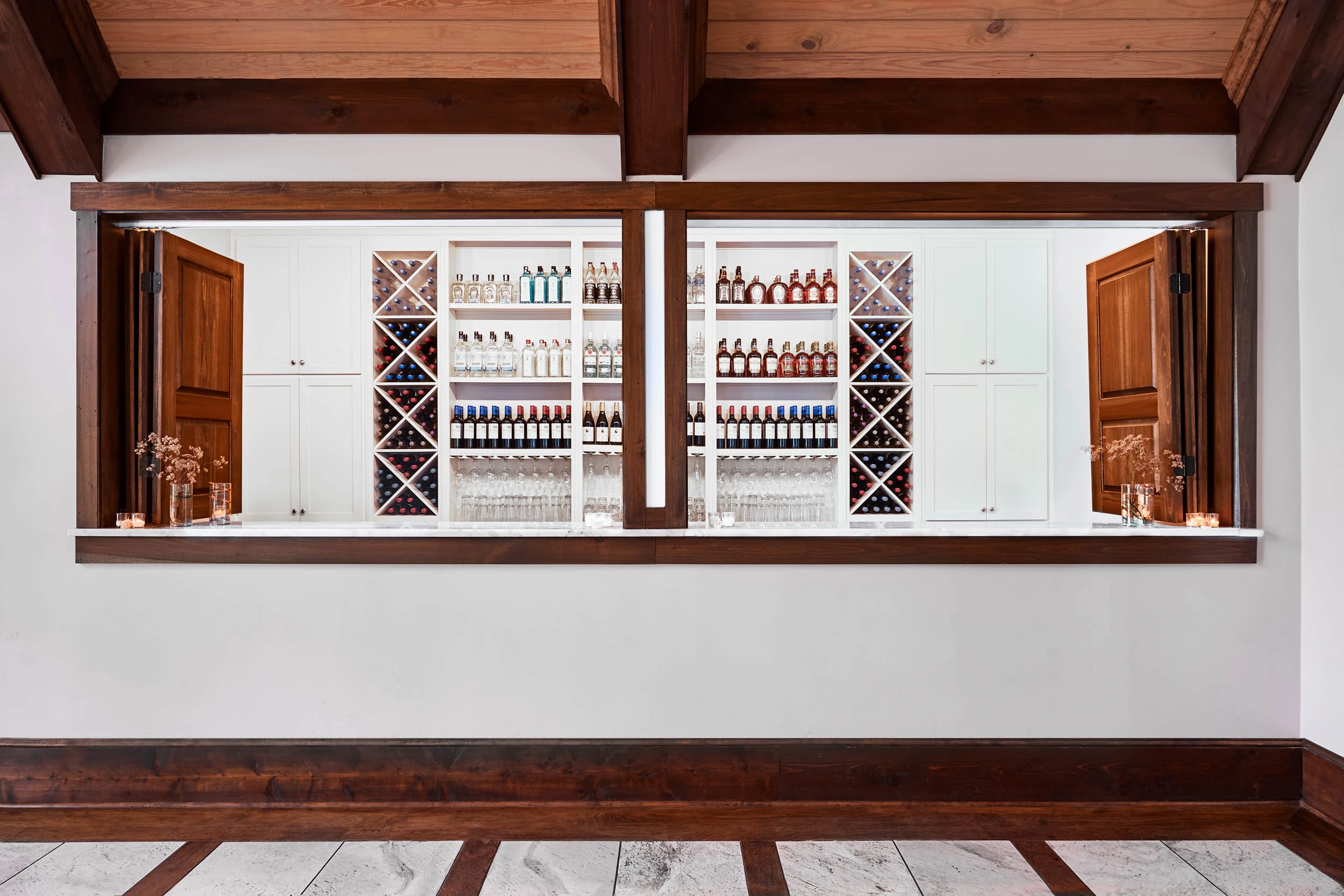 a bar with shelves of liquor and bottles