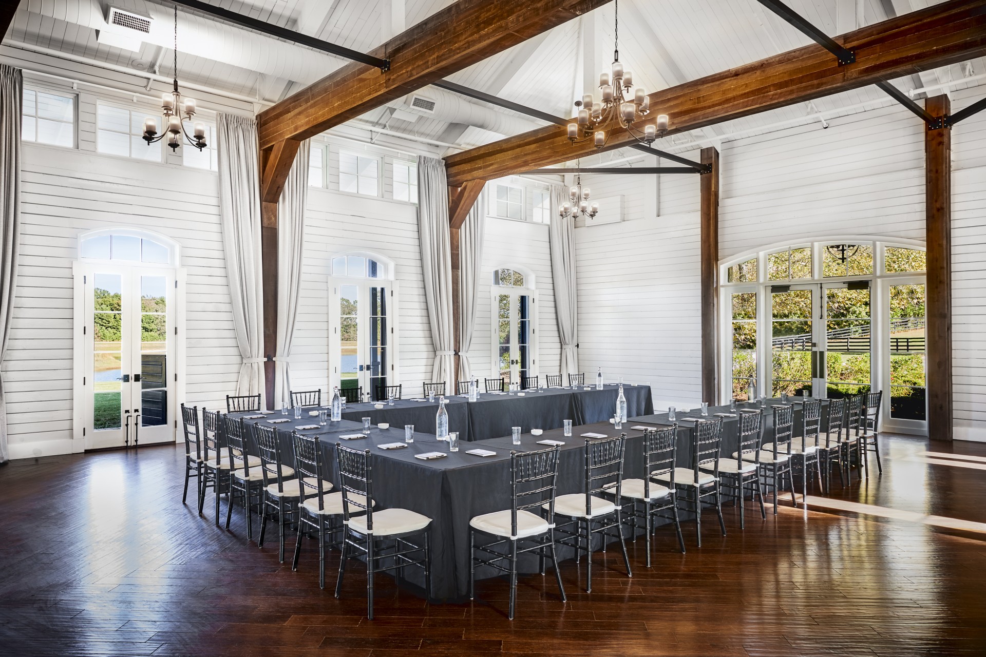 a room with a long table and chairs