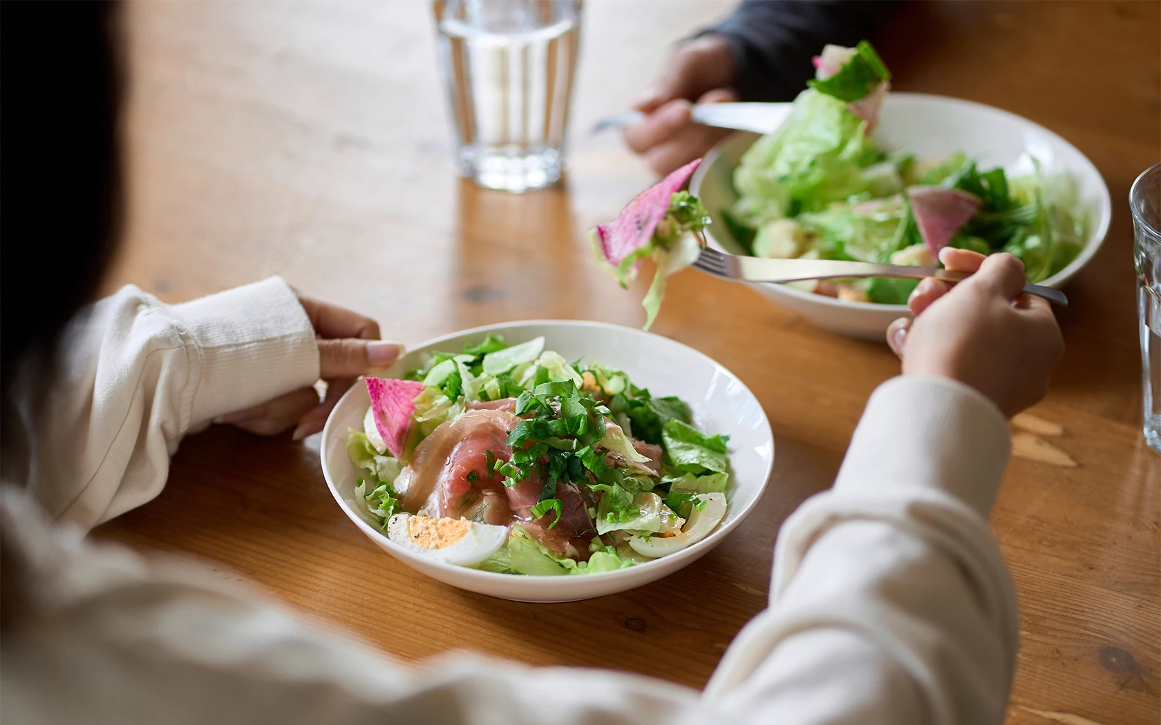 a person holding a plate of food