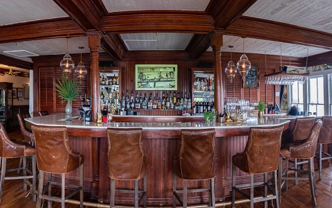 a bar with chairs and a table