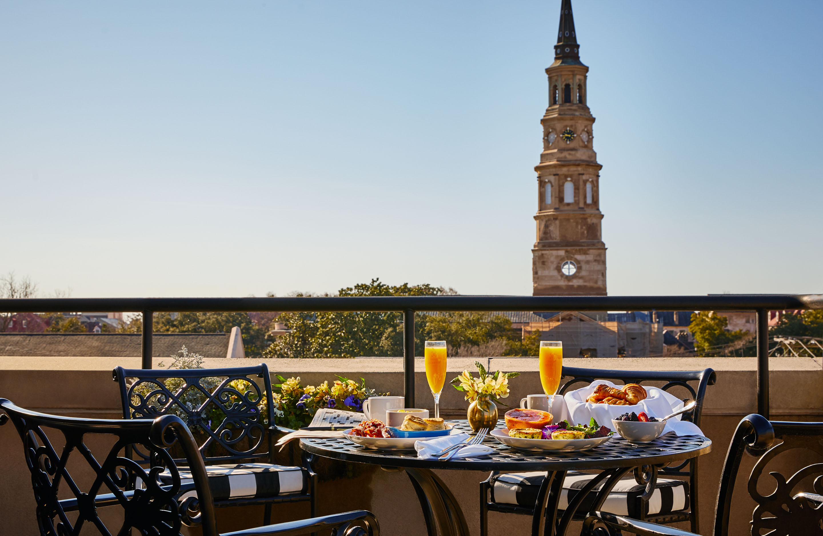 a table with food on it and a tower in the background