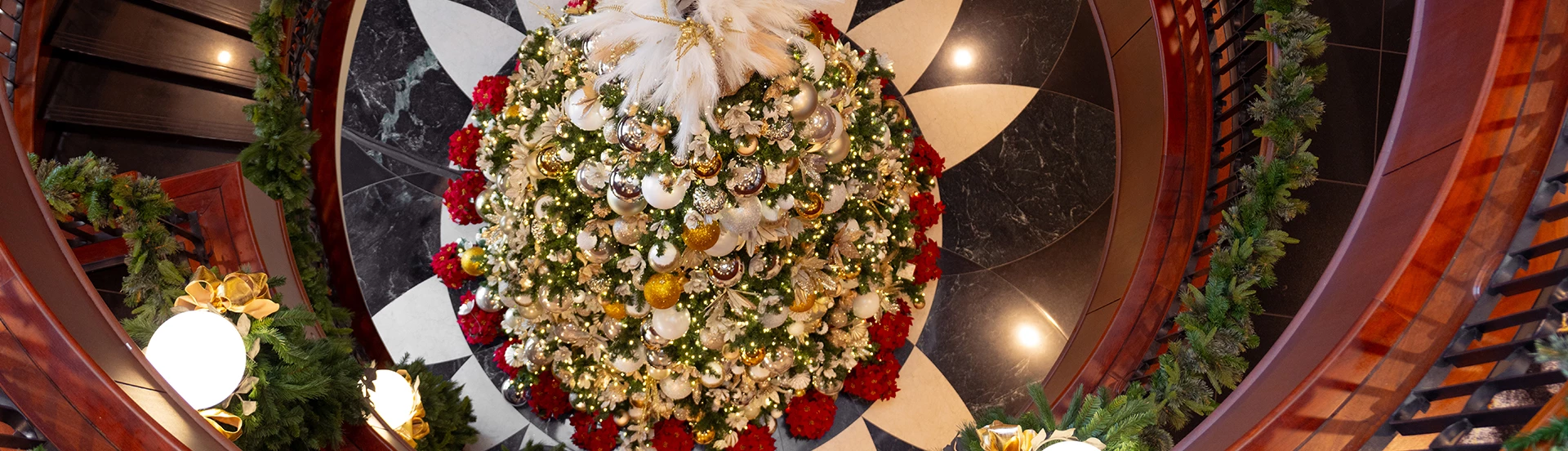 a christmas tree with ornaments and flowers