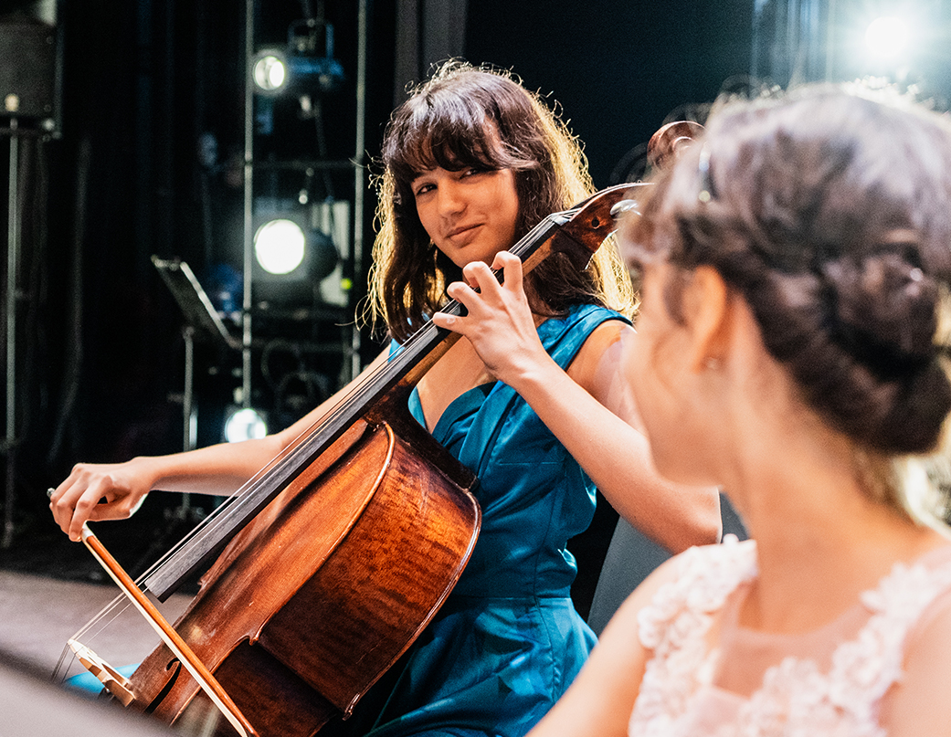 a woman playing a cello