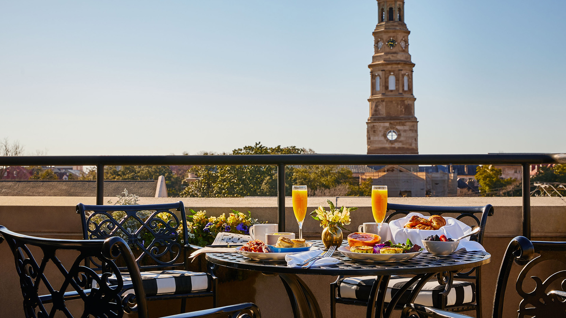 a table with food on it and a tower in the background