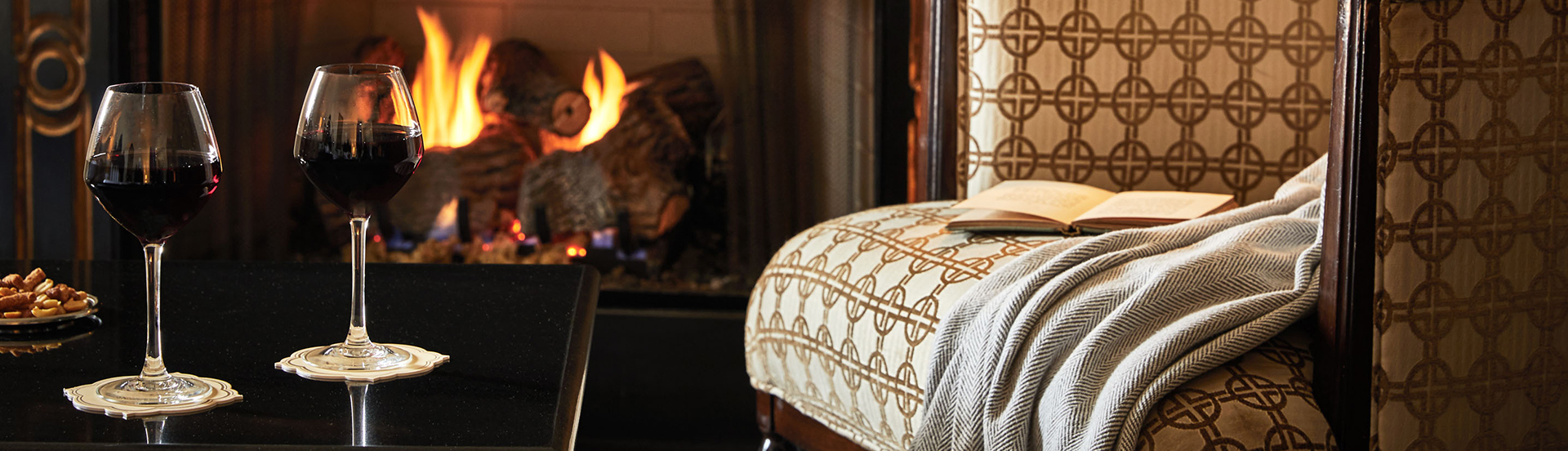a chair with a blanket and a book on it