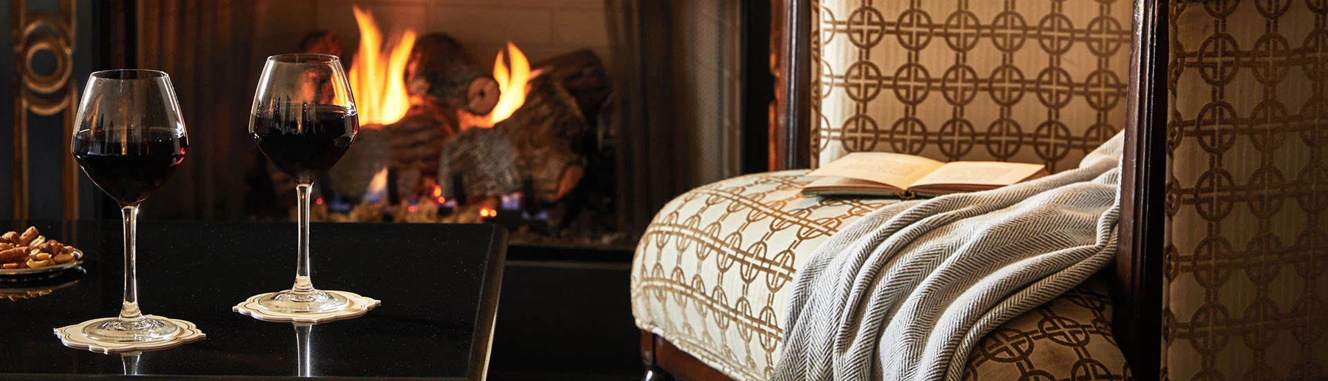 a chair with a blanket and a book on it