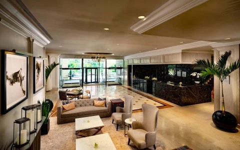 a lobby with a reception desk and chairs