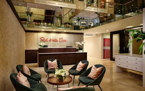 a lobby with a reception desk and chairs