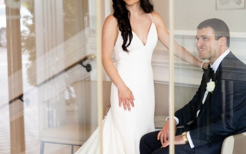 a woman in a white dress and a man in a suit
