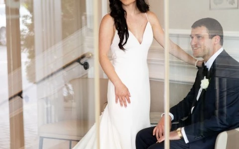 a woman in a white dress and a man in a suit