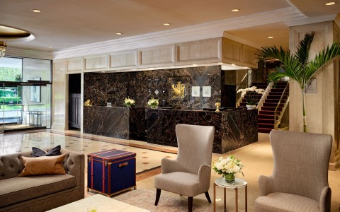 a lobby with a marble counter and chairs