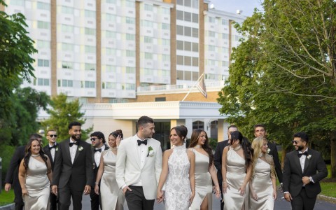 a group of people walking together in front of a building
