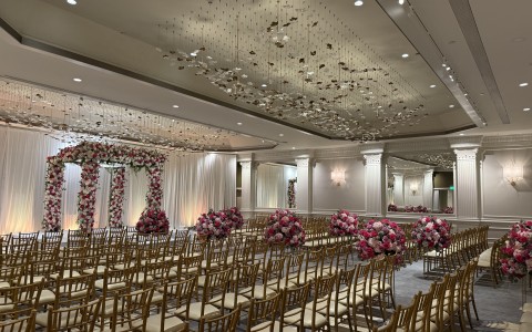 a room with chairs and flowers