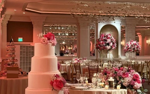 a wedding cake with flowers on a table